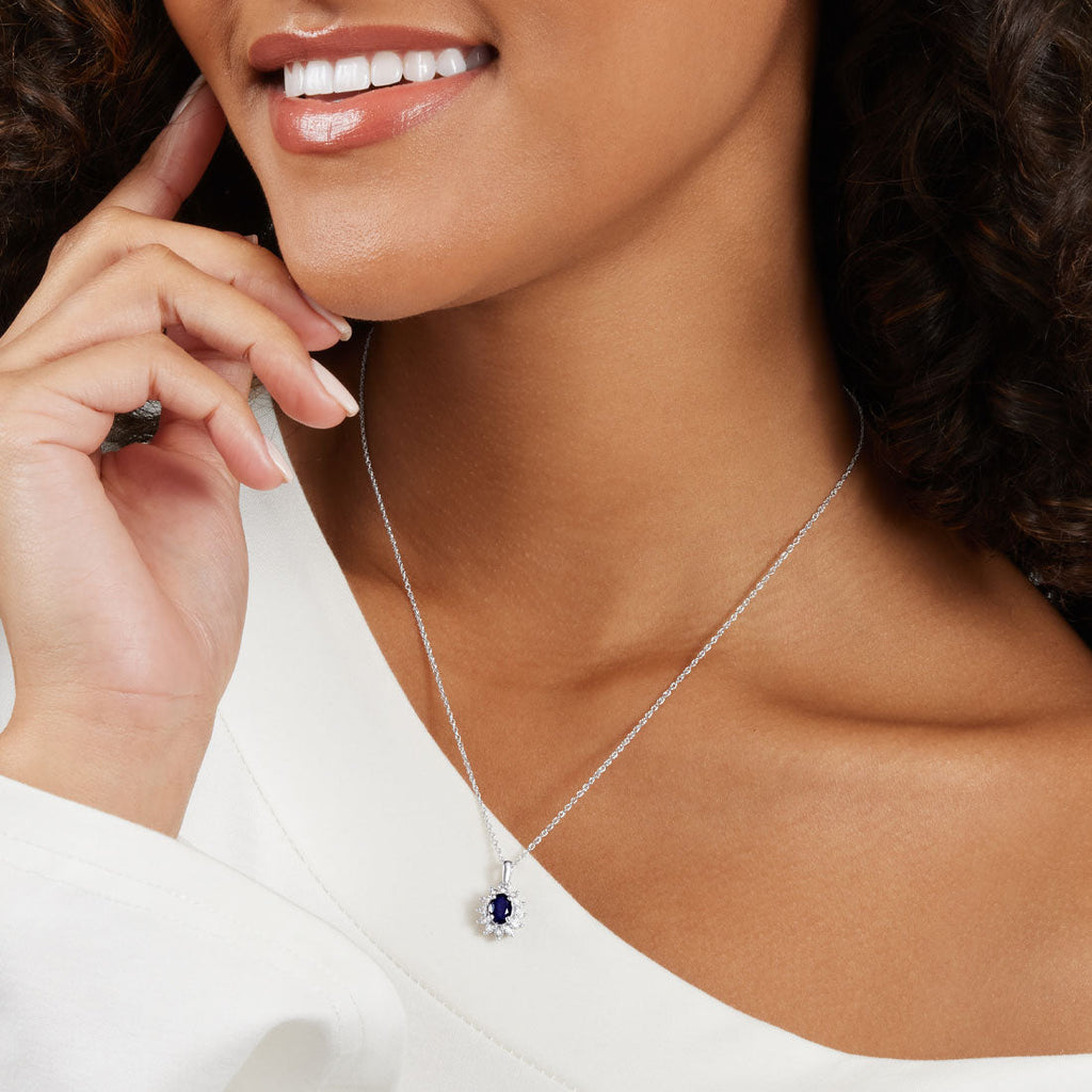 45cm Oval Created Sapphire Halo Necklace with 0.05tw of Diamonds in Sterling Silver